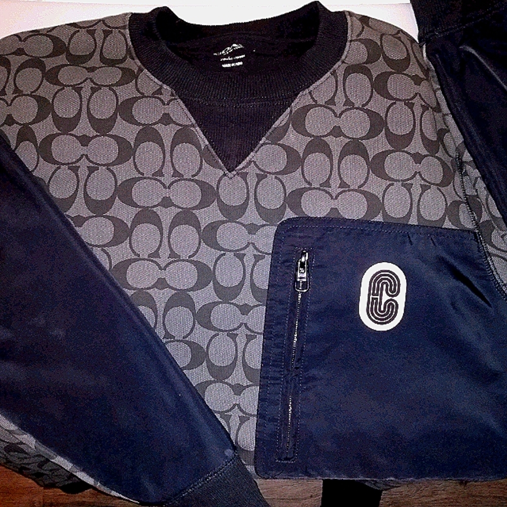 A crew neck coach sweater